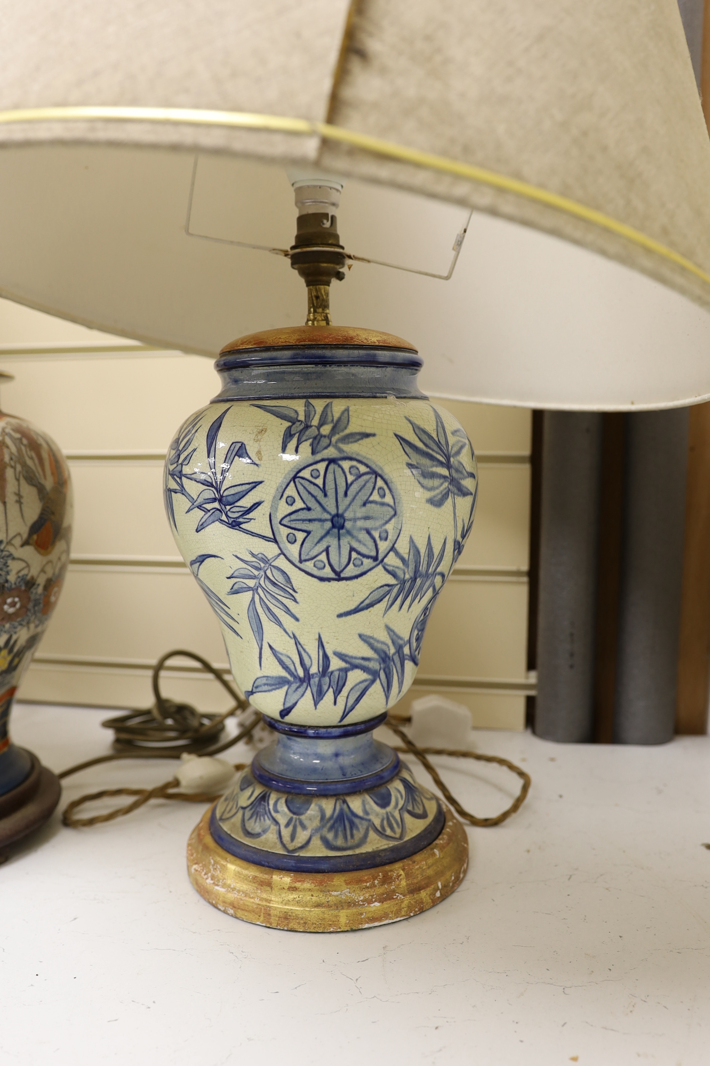 A pair of Chinese crackleware lamps, 40cm high, and a European pottery lamp (3)